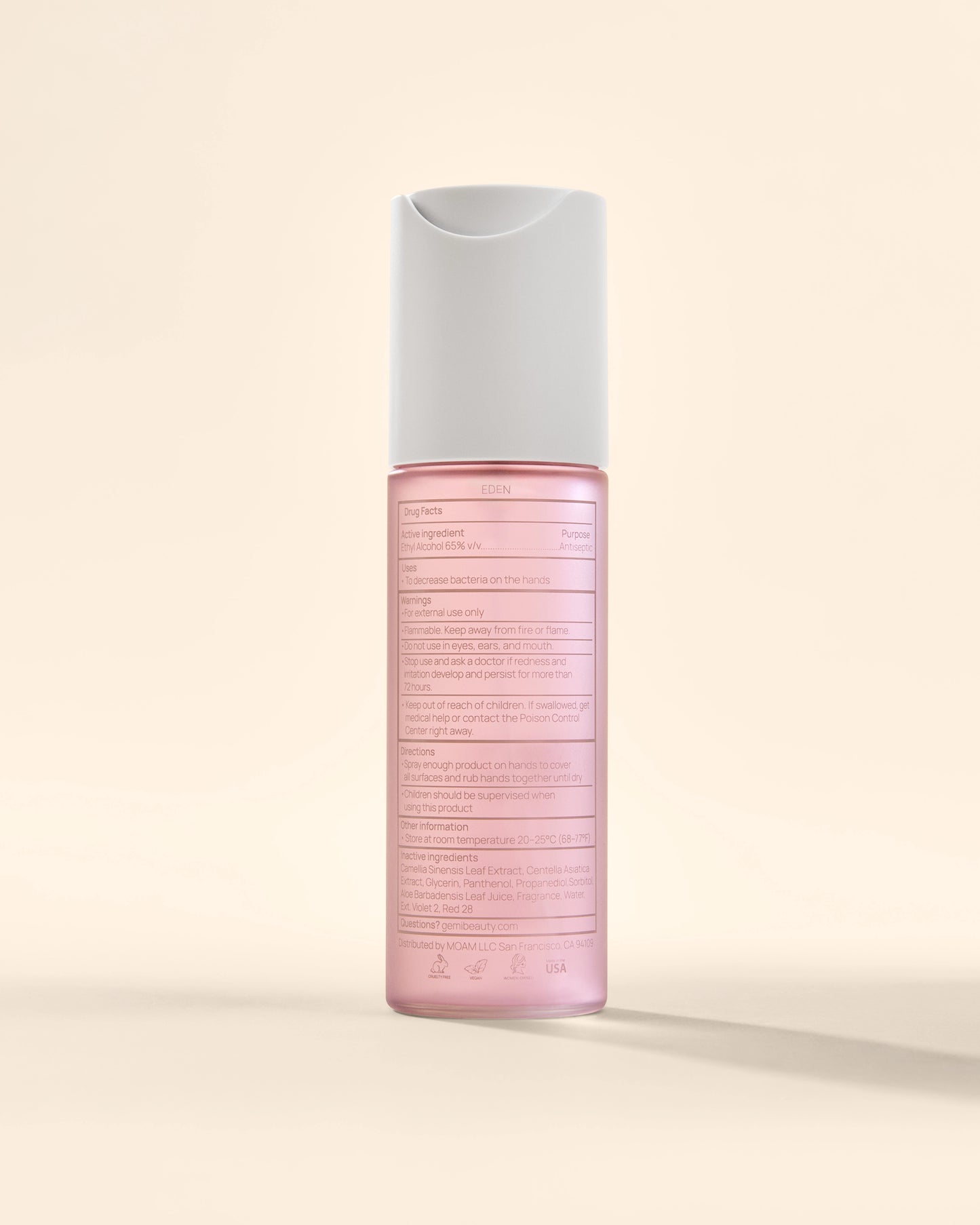 Pink bottle with a white cap on a beige background