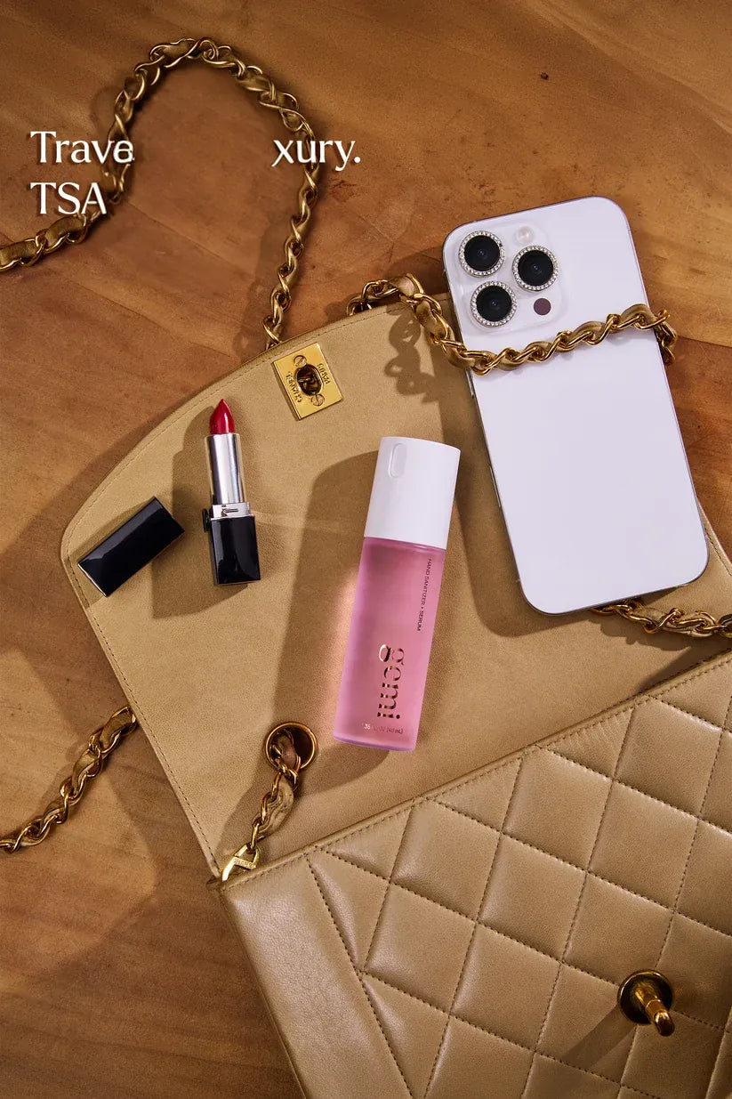 gemi Eden in a handbag with lipstick and phone